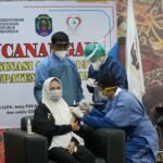 Hj Asmin Laura Hafid SE MM